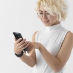 medium-shot-woman-holding-phone